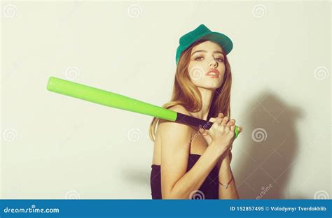 Pretty Woman With Long Hair Holds Green Baseball Bat Stock Image