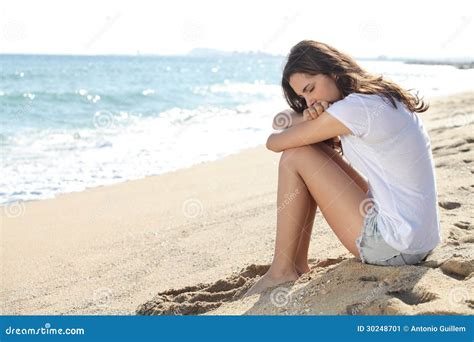 Portrait Of A Worried Girl Sitting On The Beach Stock Image Image Of