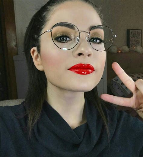 Brunette Girl With Wire Rimmed Glasses And Ultra Shiny Red Lips