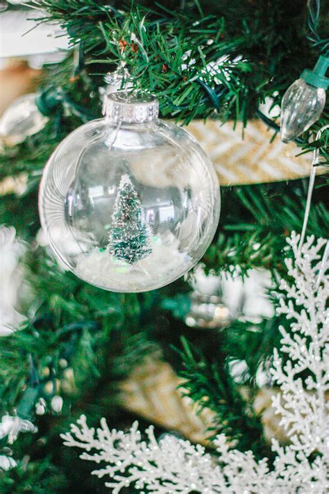 Small plush toys and favorite toys make great additions to a family home tree. DIY Snow Globe Ornament - Fill a clear ornament with a bottle brush tree!