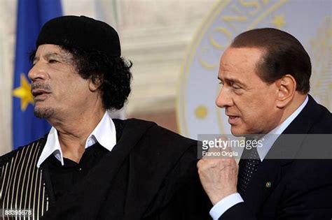 Libyan Leader Muammar Qaddafi Meets Silvio Berlusconi Photos And
