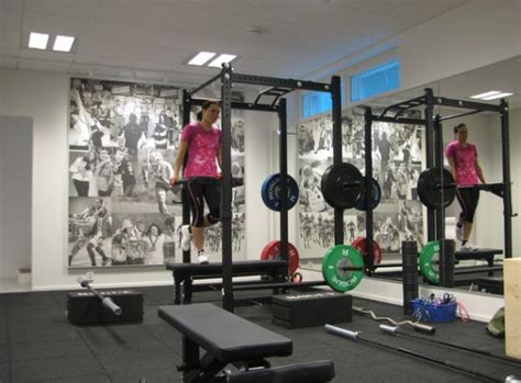 Traditional home gym in other with blue walls and brown floor. 70+ Home Gym Ideas and Gym Rooms to Empower Your Workouts