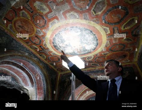 Catacomb archeological superintendent Fabrizio Bisconti shows to