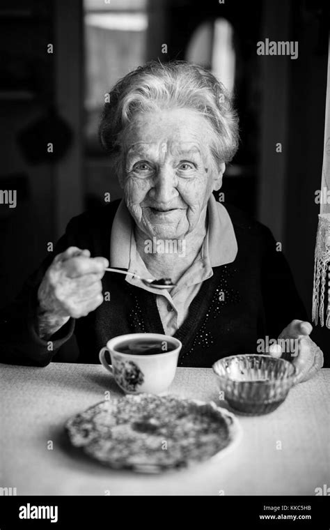 Portrait Of An Elderly Woman Drinking Tea Stock Photo Alamy