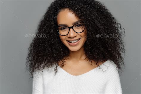 Curly Haired Smiling Woman Has Healthy Dark Skin Afro Hairstyle