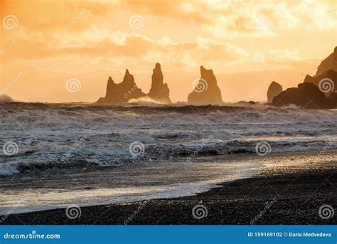 Sunset At Reynisdrangar Cliffs On Black Sand Beach In Vik Iceland