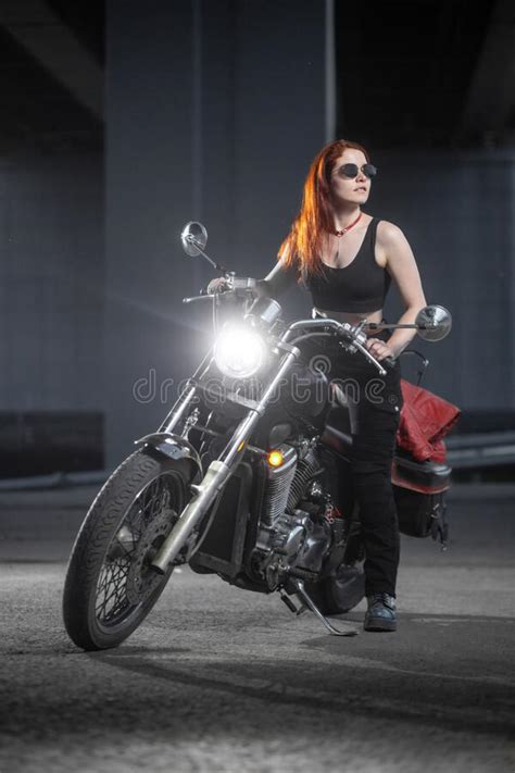 Girl Biker Sexually Posing On Motorcycle At Night City Stock Image