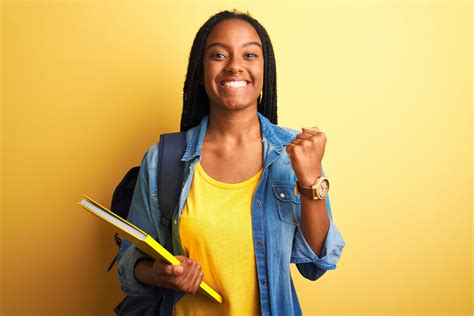 African American Student Woman Wearing Backpack And Book Over Isolated