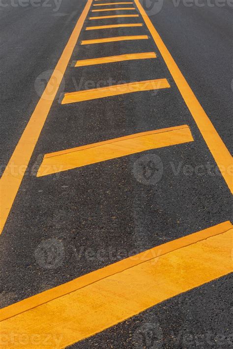 Yellow Line Symbol On A New Paved Road 7675442 Stock Photo At Vecteezy