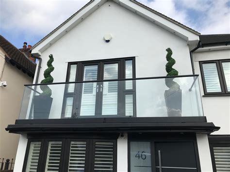 Semi Frameless Glass Balcony With Black Handrail Near Epping Forest