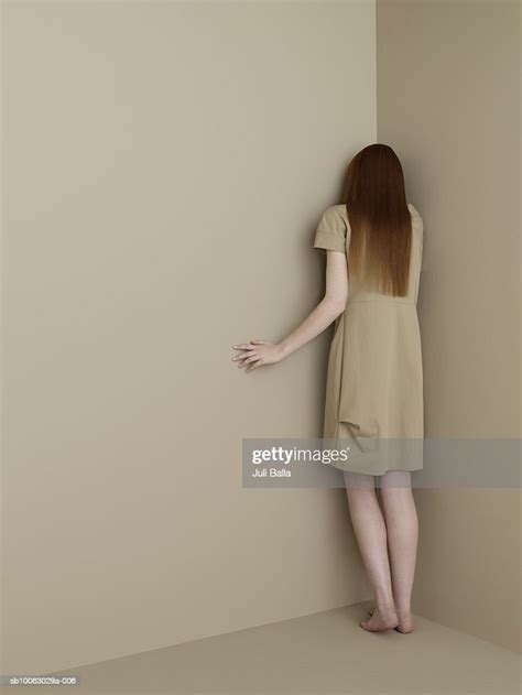 Young Woman Facing Wall Rear View High Res Stock Photo Getty Images