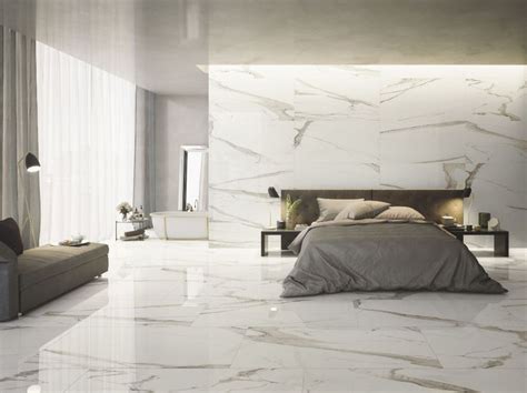 A Bedroom With Marble Flooring And White Walls