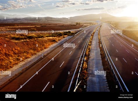 Sunset And Road Landscape Highways And Road Transport Concept Stock
