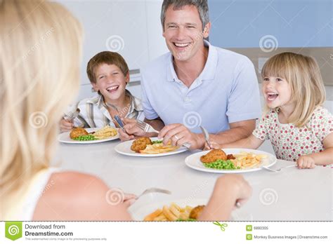 Family Eating a Meal,mealtime Together Stock Image - Image of adult