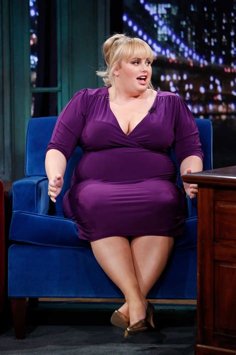 Rebel Wilson Shows Off Her Toned Physique By Doing Squats Holding A