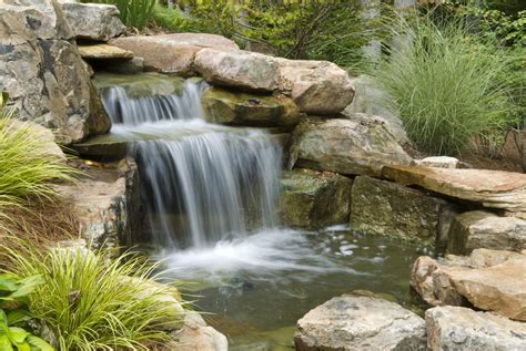 Turn your backyard into a jungle nook hideaway. How to Build Outdoor Waterfalls Inexpensively