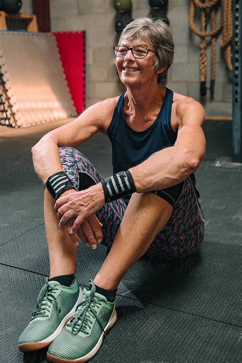 Senior Woman Stretching At Gym By Stocksy Contributor RZCREATIVE Stocksy