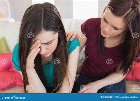Girl Comforting Her Crying Friend On The Couch Stock Image Image
