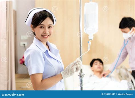 Nurse With Medical Drug And Infusion Saline Doctor And Nurse With