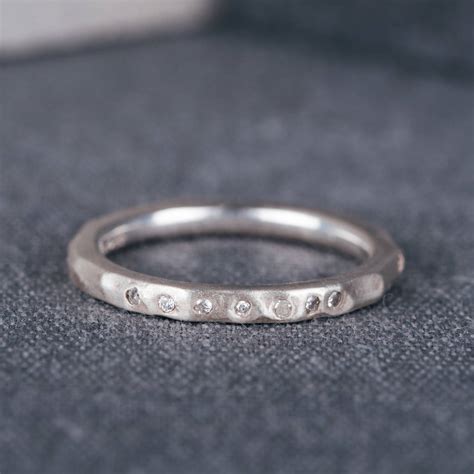 All wedding & engagement rings. 9ct white gold hammered wedding ring with diamonds by ...