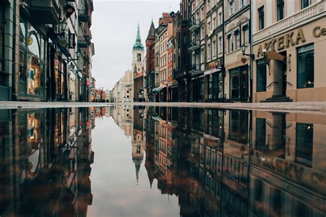 Reflection Of Buildings On Body Of Water · Free Stock Photo