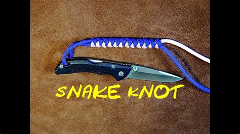 Tighten the knot, bringing it as close to the folded end as possible. Two Colour Snake Knot Paracord Knife Lanyard - How to Tie - YouTube