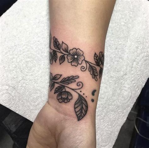 floral vine wrist tattoo by tania leah wrist tattoos for women flower wrist tattoos cuff tattoo