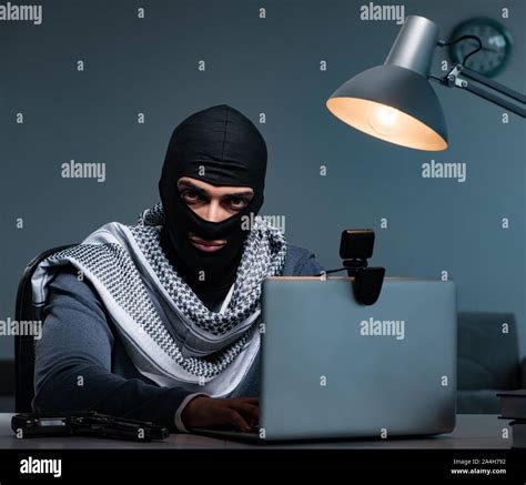 The Hacker Wearing Balaclava Mask Hacking Computer Stock Photo Alamy