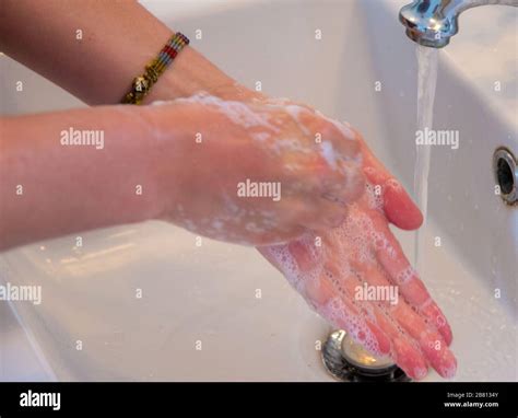 Woman Wash Her Hands In Bathroom Stock Photo Alamy