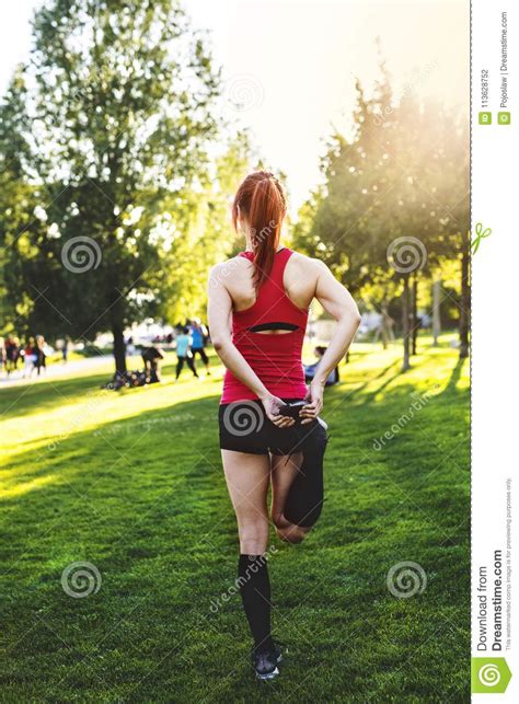 Young Runner Stretching And Warming Up In Park Stock Photo Image Of