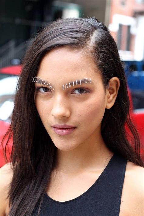 A Woman With Fake Eyelashes On Her Face