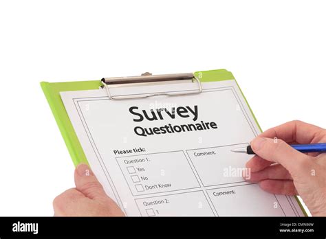 Hand With Pen Completing Market Research Survey Questionnaire Stock