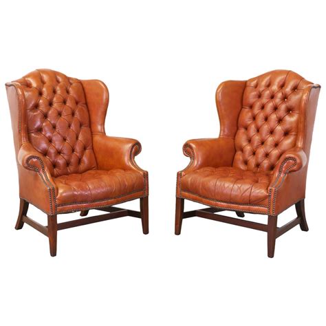 Love their quirky attitude, they'd look at home by mad hatter's table. Brass Tacked Tufted Leather High Back Wing Chairs | From a ...