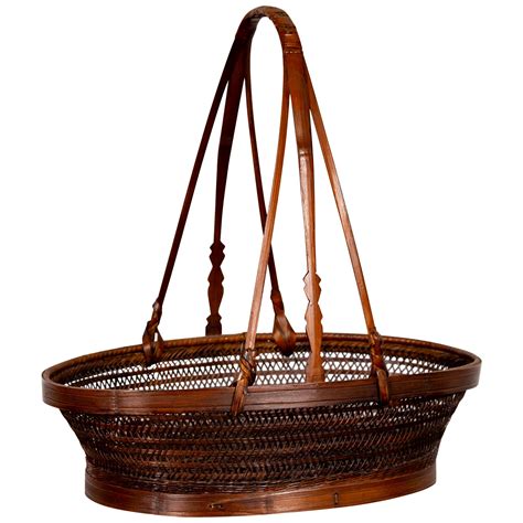 Chinese Vintage Tiered Rattan Picnic Basket With Large Handle And Metal Accents For Sale At