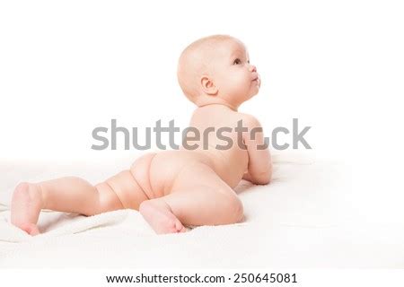 Cute Baby Lying On White Blanket On Stomach Knee Bent Isolated Over White Background Stock