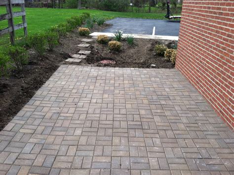 Most patios are set on a concrete slab or a sand and pebble base. Paver Stone Patios Installation | Russell Landscape Services
