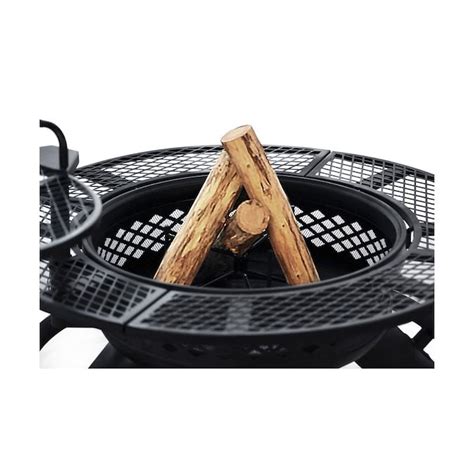 An Outdoor Fire Pit With Two Logs Sticking Out Of It