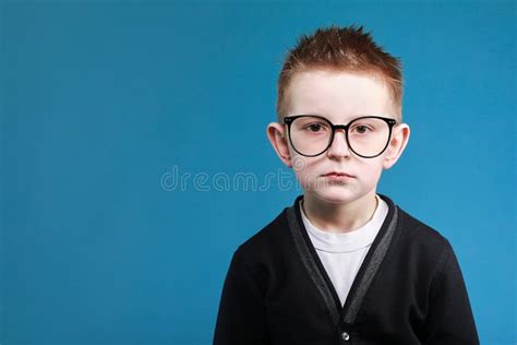 Back To School Portrait Of Sad Little Clever School Boy In Glasses