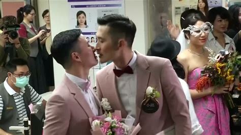 taiwan celebrates asia s first same sex marriages as couples tie knot