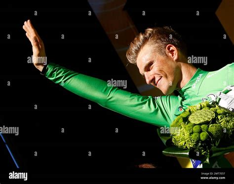 germany s marcel kittel wearing the best sprinter s green jersey celebrates on the podium after