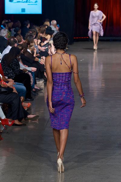 Model In Purple Dress Walking Down The Runway On Fashion Week San Diego