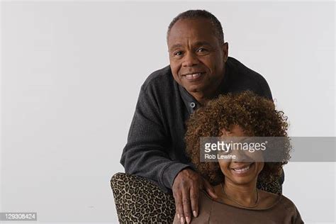 Biracial Couple Sitting White Background Photos Et Images De Collection Getty Images