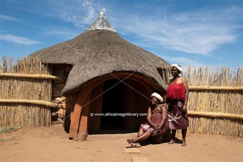 Photos And Pictures Of Basotho Women In Front Of Traditional Hut Thaba Bosiu Cultural Village