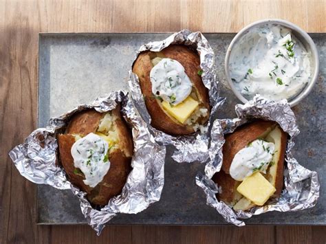 An alternate method, if you don't want to eat the skins, is to just put the sweet potato right down into the coals to bake. Camping Baked Potatoes with Herbed Sour Cream Recipe | Guy ...