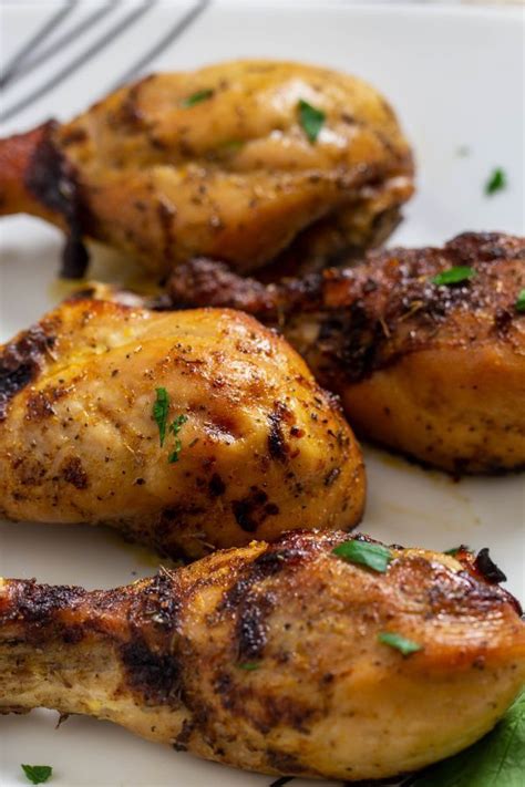 Place the chicken in the melted butter in the prepared pans. Marinated Chicken baked in the oven and served on a ...