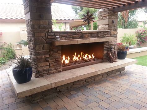Contemporary Fireplace In Greenfield Garden Mulched Flower Bed By