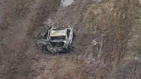 Dead Body Found By Construction Workers Near Burned Car Near Grand