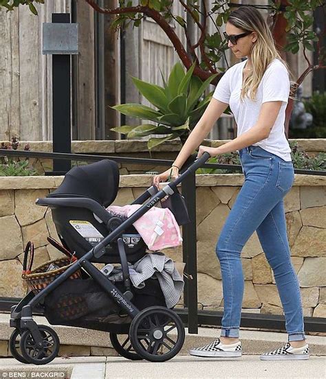 April Love Geary Beams In Blue Jeans While Taking Two Month Old