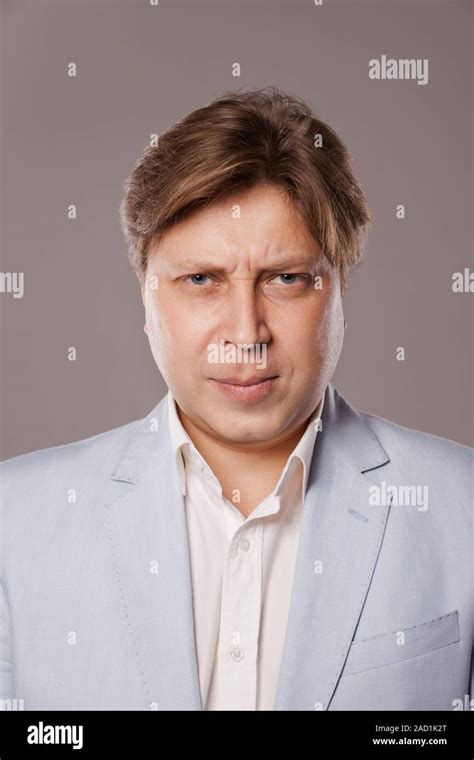 Angry Frowning Middle Age Man In Blue Jacket Stock Photo Alamy