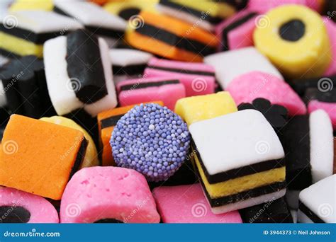 Vivid Licorice Candies With Sugar Background Stock Image